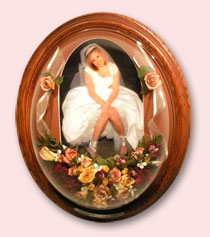 preserved wedding flowers and ribbon around photo of bride in oak frame