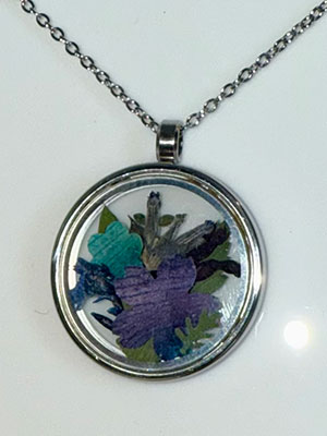 pressed flowers in silver necklace